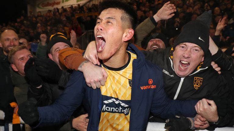 MAIDSTONE, ENGLAND - DECEMBER 2: Bivesh Gurung of Maidstone United celebrates with fans after the Emirates FA Cup Second Round match between Maidstone United and Barrow at Gallagher Stadium on December 2, 2023 in Maidstone, England. (Photo by Henry Browne/Getty Images)