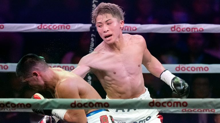 Naoya Inoue of Japan punches Marlon Tapales of the Philippines in the sixth round of their boxing match for the unified WBA, WBC, WBO and IBF super bantamweight world titles in Tokyo, Tuesday, Dec. 26, 2023. (AP Photo/Hiro Komae)