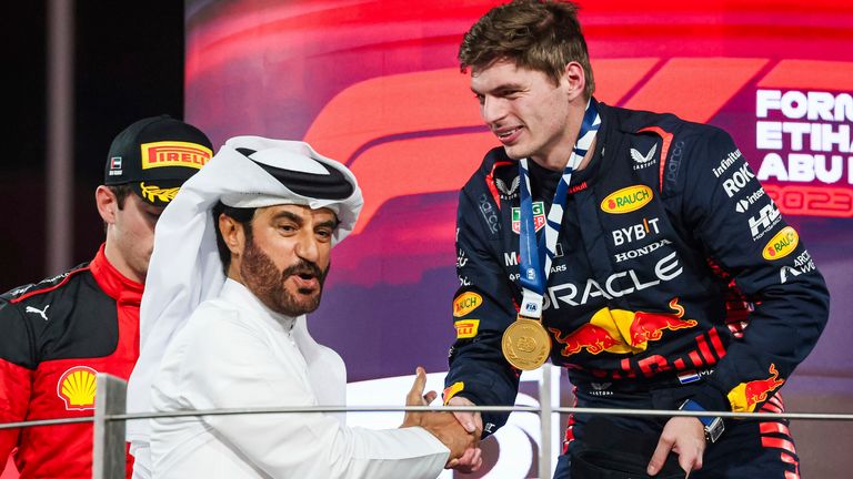 Mohammed Ben Sualyem congratulates Max Verstappen on the podium in Abu Dhabi