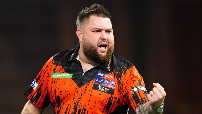 Michael Smith reacts during his match against Kevin Doets (not pictured) on day one of the Paddy Power World Darts Championship at Alexandra Palace, London. Picture date: Friday December 15, 2023.