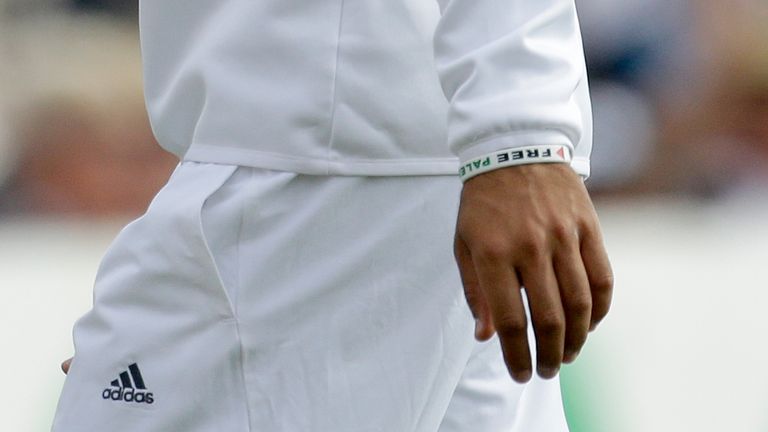 England&#39;s Moeen Ali wears a wristband as he fields during the second day of the third cricket test match of the series between England and India at The Ageas Bowl in Southampton, England, Monday, July 28, 2014. 