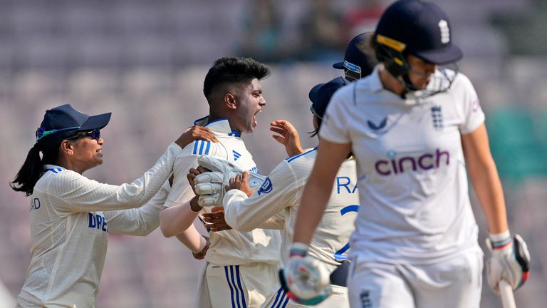 Indian cricketers celebrate after the dismissal England's Nat Sciver-Brunt on the third day of the first test cricket match between India and England in Mumbai, India, Saturday, Dec. 16, 2023. (AP Photo/Rajanish Kakade)