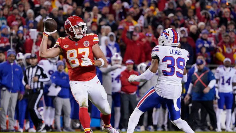 Kansas City Chiefs tight end Travis Kelce (87) laterals to teammate Kadarius Toney, not seen, as Buffalo Bills cornerback Cam Lewis (39) defends during the second half of an NFL football game Sunday, Dec. 10, 2023, in Kansas City, Mo. Toney ran the ball into the end zone, but the play was nullified by an offside penalty by Toney.