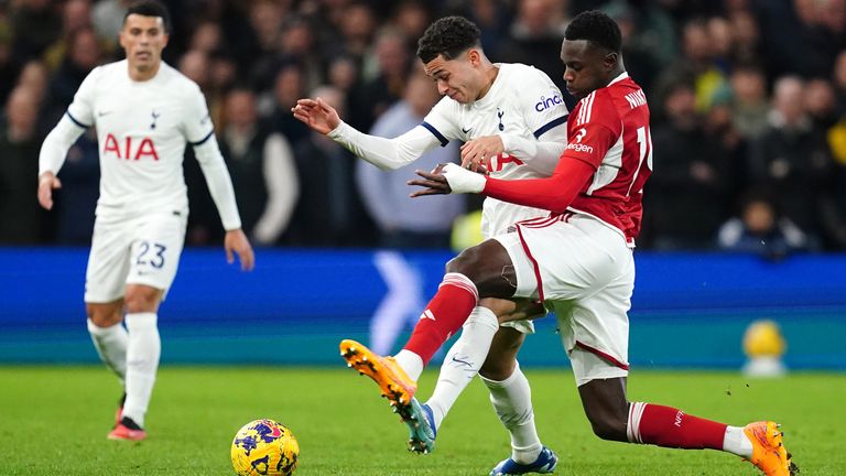 Tottenham's Brennan Johnson and Nottingham Forest's Moussa Niakhate battle for the ball