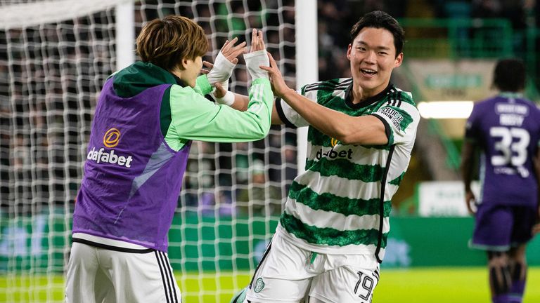 GLASGOW, SCOTLAND - DECEMBER 06: Celtic&#39;s Oh Hyeon-gyu celebrates with Kyogo Furuhashi after making it 4-0 during a cinch Premiership match between Celtic and Hibernian at Celtic Park, on December 06, 2023, in Glasgow, Scotland. (Photo by Craig Williamson / SNS Group)