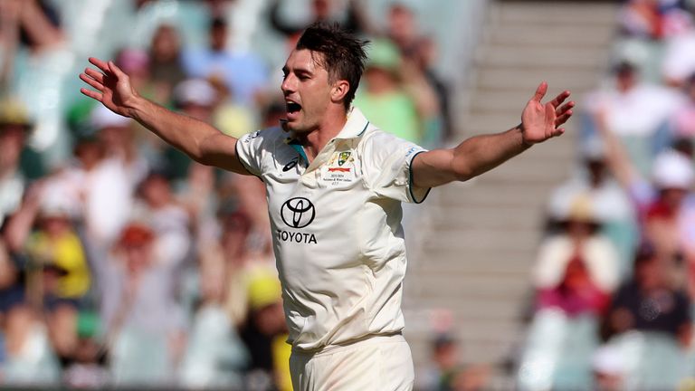 Australia's Pat Cummins celebrates after he dismissed Pakistan's Agha Salman for five