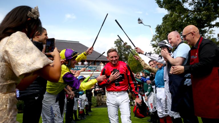 Paul Hanagan receives a guard of honour from his weighing room colleagues at York