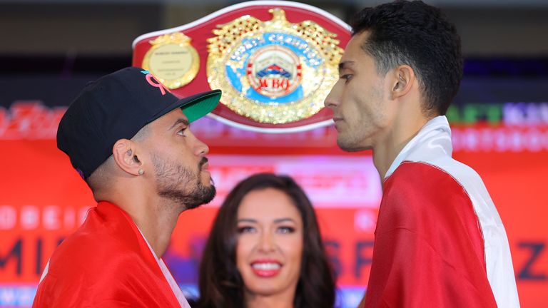 Espinoza towers over Ramirez after they weigh in for WBO featherweight title fight