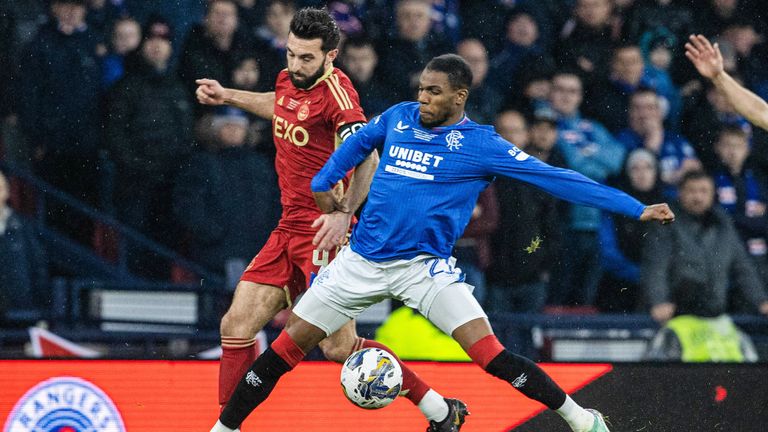 GLASGOW, SCOTLAND - DECEMBER 17: Aberdeen's Graeme Shinnie (L) and Rangers' Dujon Sterling in action during the Viaplay Cup Final match between Rangers and Aberdeen at Hampden Park, on December 17, 2023, in Glasgow, Scotland.  (Photo by Alan Harvey / SNS Group)