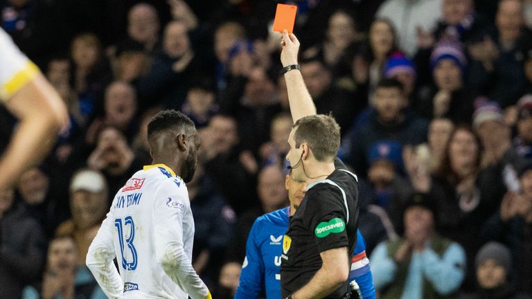 GLASGOW, SCOTLAND - DECEMBER 20: Referee Alan Muir shows St Johnstone's Diallang Jaiyesimi a red card following a VAR check during a cinch Premiership match between Rangers and St Johnstone at Ibrox Stadium, on December 20, 2023, in Glasgow, Scotland. (Photo by Alan Harvey / SNS Group)