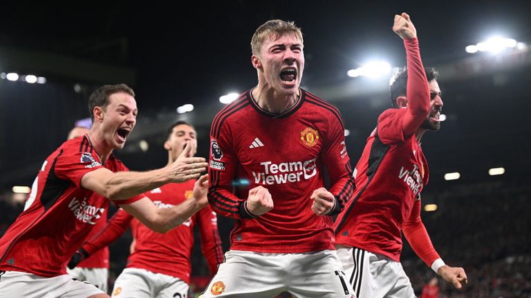 Manchester United's Danish striker #11 Rasmus Hojlund (C) celebrates after scoring vs Aston Villa