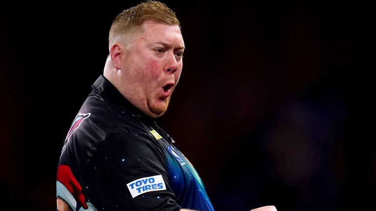 Ricky Evans celebrates during his match against Nathan Aspinall on day nine of the Paddy Power World Darts Championship at Alexandra Palace, London. Picture date: Saturday December 23, 2023.