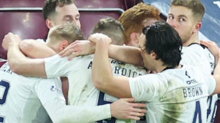 EDINBURGH, SCOTLAND - DECEMBER 30: Ross County players celebrates after they go 1-0 up through an own goal from Hearts' Alex Cochrane during a cinch Premiership match between Heart of Midlothian and Ross County at Tynecastle Park, on December 30, 2023, in Edinburgh, Scotland. (Photo by Roddy Scott / SNS Group)