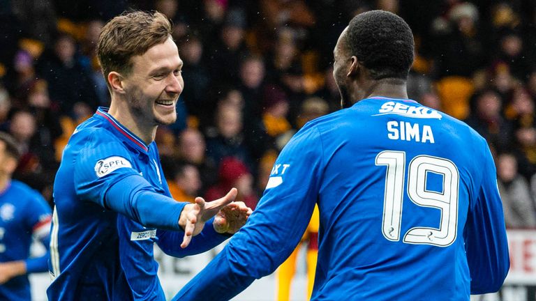 Kieran Dowell celebrates with Abdallah Sima after scoring Rangers' opening goal at Motherwell