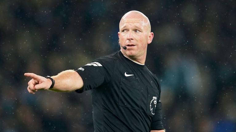 Referee Simon Hooper gestures during the English Premier League soccer match between Manchester City and Tottenham Hotspur at Etihad stadium in Manchester, England, Sunday, Dec. 3, 2023. (AP Photo/Dave Thompson)