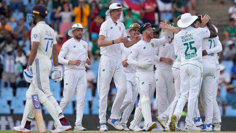 South Africa's Nandre Burger celebrates with teammates after dismissing India's batsman Yashasvi Jaiswal for five