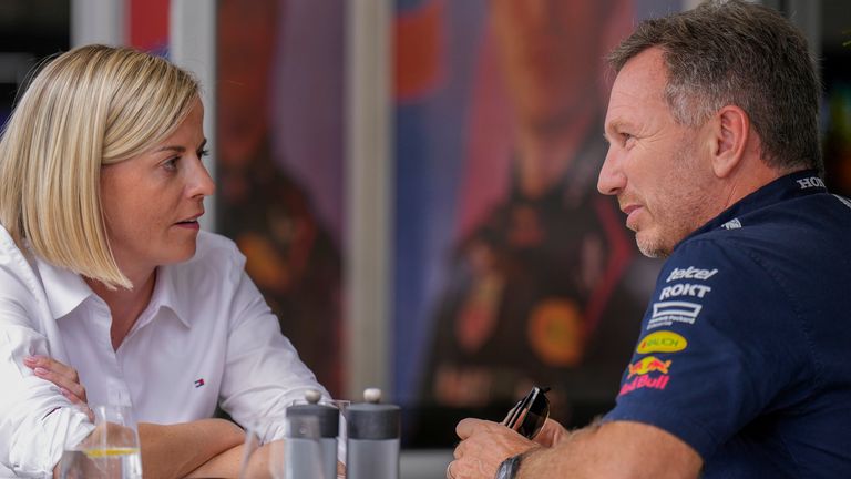Suzanne Wolff, left, managing director of F1 Academy and wife of Toto Wolff team principal & CEO of the Mercedes-AMG Petronas F1 Team, talks with Christian Horner, team principal of the Red Bull Formula One team, in the paddock of the Formula One U.S. Grand Prix auto race at Circuit of the Americas, Saturday, Oct. 21, 2023, in Austin, Texas. (AP Photo/Nick Didlick)