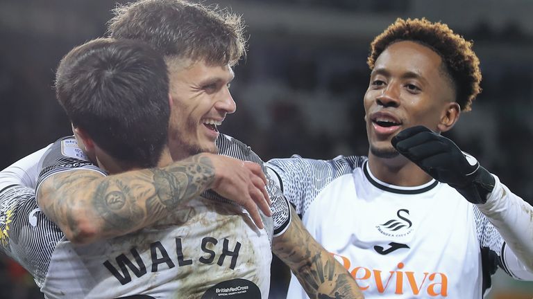 SWANSEA, WALES - DECEMBER 22: Jamie Paterson of Swansea City (C) with Liam Walsh (L) and Jamal Lowe (R) celebrates his goal during the Sky Bet Championship match between Swansea City and Preston North End at the Swansea.com Stadium on December 22, 2023 in Swansea, Wales. (Photo by Athena Pictures/Getty Images)