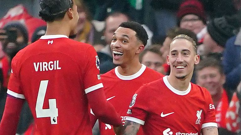 Liverpool&#39;s Trent Alexander-Arnold (second right) celebrates after scoring the opening goal of the game
