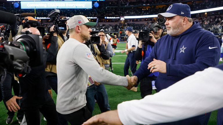 Green Bay Packers head coach Matt LaFleur (left) talks with Dallas Cowboys head coach Mike McCarthy following the playoff loss