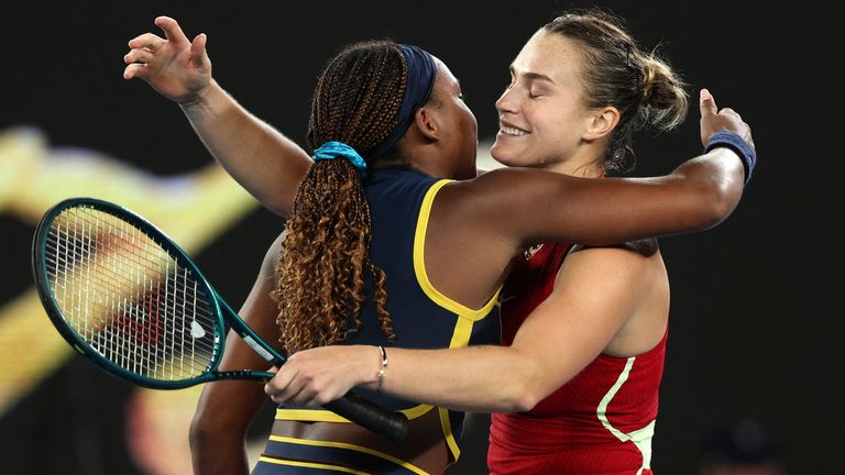 Belarus' Aryna Sabalenka (R) embraces USA's Coco Gauff after their women's singles semi-final match on day 12 of the Australian Open tennis tournament in Melbourne on January 25, 2024. (Photo by Martin KEEP / AFP) / -- IMAGE RESTRICTED TO EDITORIAL USE - STRICTLY NO COMMERCIAL USE --