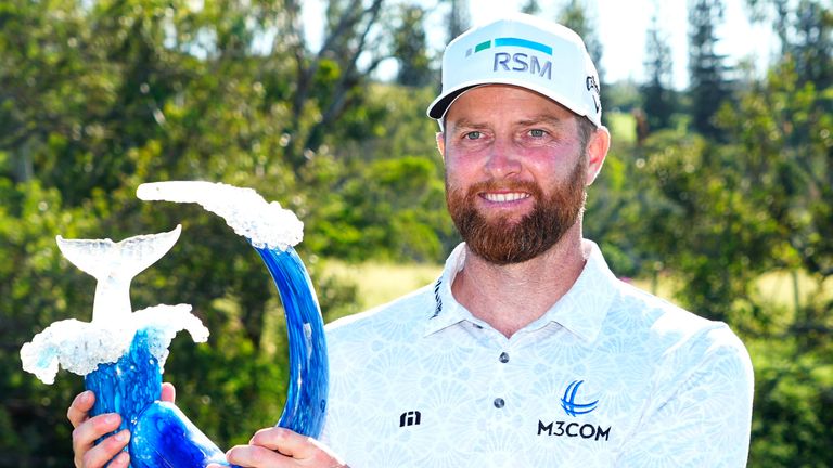 Chris Kirk holds the champions trophy after the final round of The Sentry golf event, Sunday, Jan. 7, 2024, at Kapalua Plantation Course in Kapalua, Hawaii. (AP Photo/Matt York)