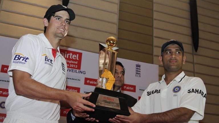England's captain Alastair Cook, left, and his Indian counterpart Mahendra Singh Dhoni, unveils the trophy ahead of their Test tour in 2012