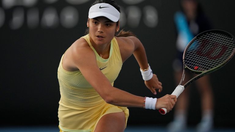 Emma Raducanu of Britain runs to return a shot to Shelby Rogers of the U.S. during their first round match at the Australian Open tennis championships at Melbourne Park, Melbourne, Australia, Tuesday, Jan. 16, 2024. (AP Photo/Louise Delmotte)