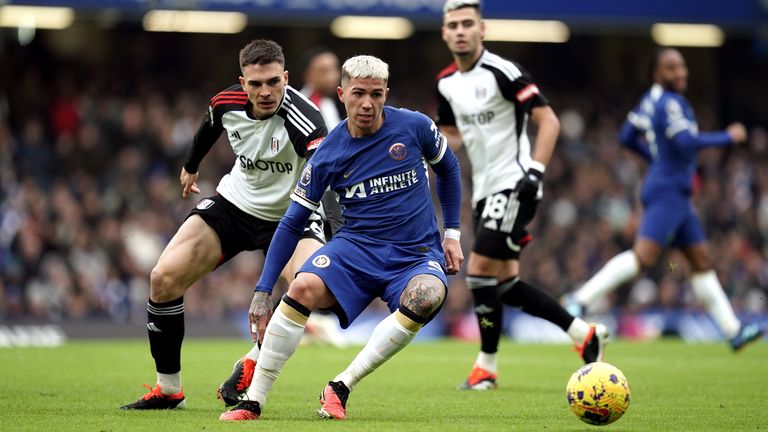 Chelsea's Enzo Fernandez holds off Fulham's Joao Palhinha