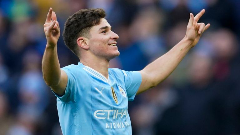 Julian Alvarez salutes the home fans after scoring Man City's second goal against Huddersfield