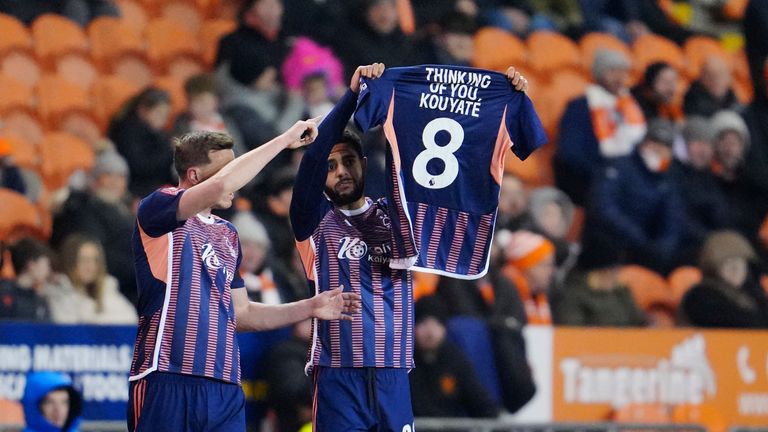 Nottingham Forest's Andrew Omobamidele, right, celebrates with is teammate after scoring his side's opening goal during the English FA Cup 3rd round replay soccer match between Blackpool and Nottingham Forest at the Bloomfield Road stadium in Blackpool, England, Wednesday, Jan. 17, 2024. (AP Photo/Jon Super)