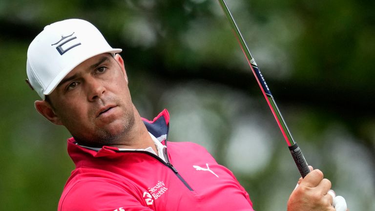 FILE - Gary Woodland watches his tee shot on the fourth hole during the weather-delayed third round of the Masters golf tournament at Augusta National Golf Club on April 8, 2023, in Augusta, Ga. Woodland returns to competition at the Sony Open following Sept. 18, 2023, brain surgery. (AP Photo/Mark Baker, File)
