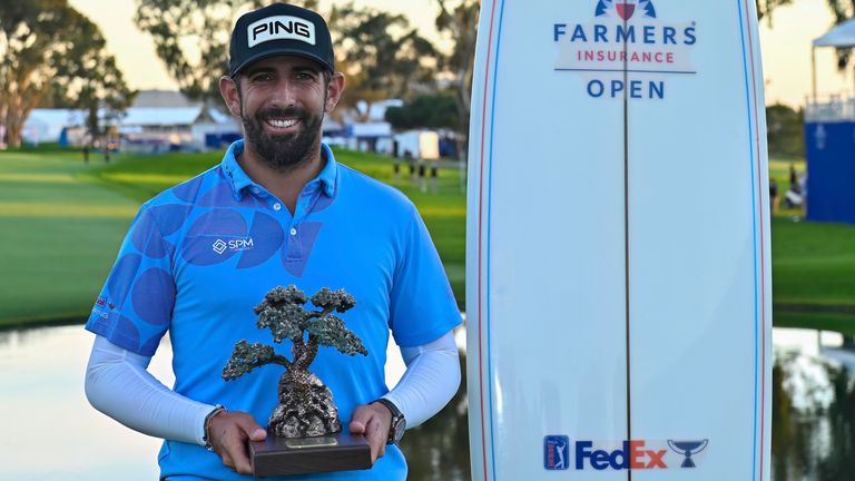 Matthieu Pavon holds the trophy after winning the the Farmers Insurance Open at Torrey Pines South in San Diego