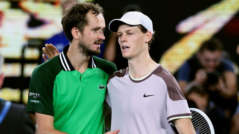 Jannik Sinner, right, of Italy is congratulated by Daniil Medvedev of Russia following the men's singles final at the Australian Open tennis championships at Melbourne Park, in Melbourne, Australia, Sunday, Jan. 28, 2024. (AP Photo/Asanka Brendon Ratnayake)