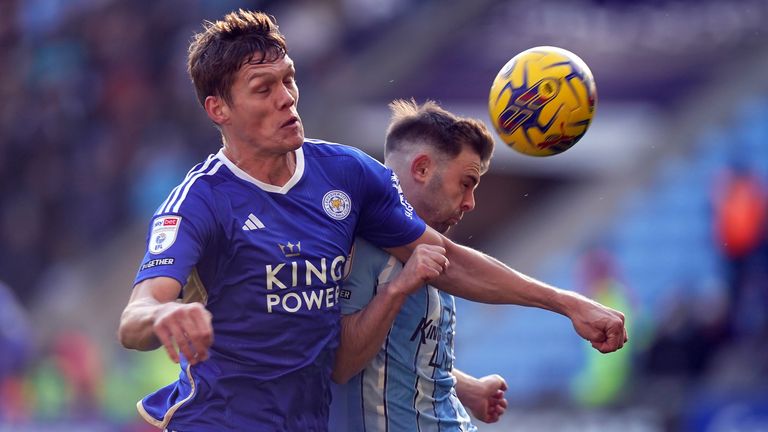 Leicester City's Jannik Vestergaard and Coventry City's Matthew Godden (right) battle for the ball