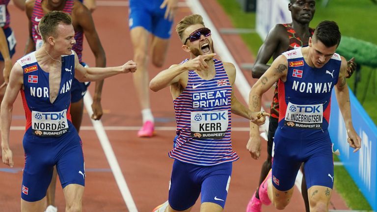 Kerr celebrates as he crosses the line first in the 1500m final at the World Championships
