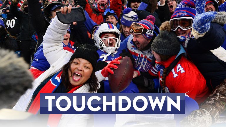 Buffalo Bills tight end Dawson Knox celebrates with fans