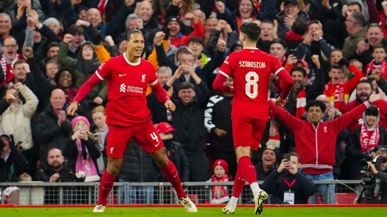 Liverpool's Virgil van Dijk celebrates after scoring his side's fourth goal (AP)