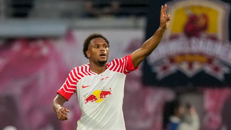 Leipzig&#39;s Lois Openda celebrates scoring his side&#39;s opening goal during the German Bundesliga soccer match between Leipzig and Bayern Munich, at the Red Bull Arena stadium in Leipzig, Germany, Saturday, Sept. 30, 2023. (AP Photo/Matthias Schrader)