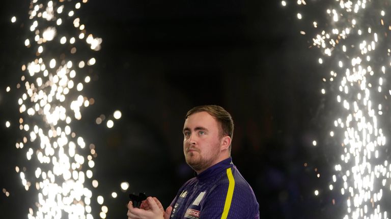 Luke Littler of England arrives for the semifinal match against Scott Williams of England at the World Darts Championship, in London, Tuesday, Jan. 2, 2024. (AP Photo/Kin Cheung)
