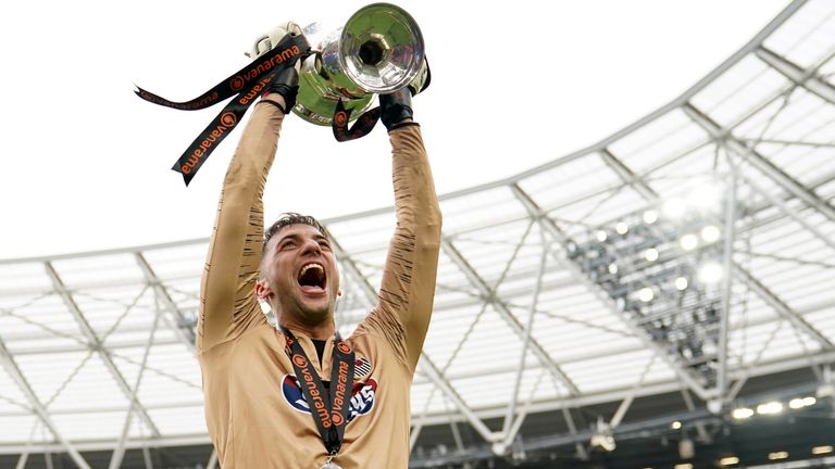 Grimsby Town goalkeeper Max Crocombe celebrates with the Vanarama National League Final trophy after their side's victory during the Vanarama National League play off final match at the London Stadium, London. Picture date: Sunday June 5, 2022.