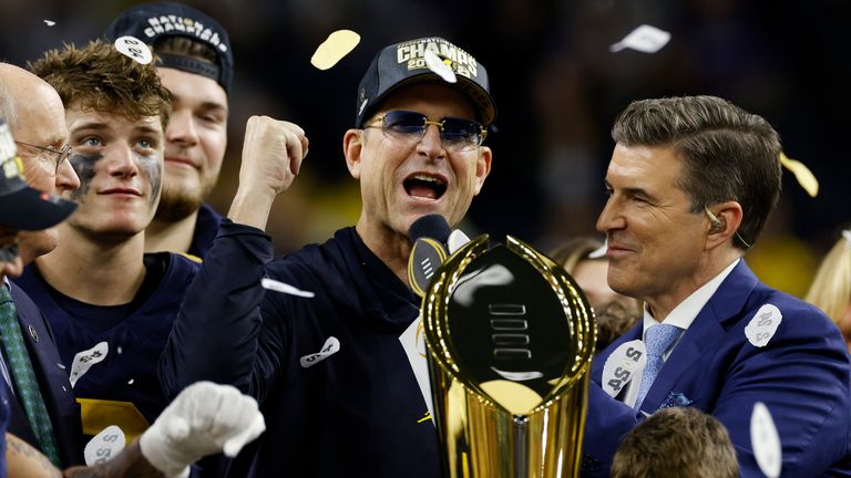 Michigan Wolverines head coach Jim Harbaugh celebrates following the CFP National Championship against the Washington Huskies at NRG Stadium in Houston (Photo by Joe Robbins/Icon Sportswire) (Icon Sportswire via AP Images)