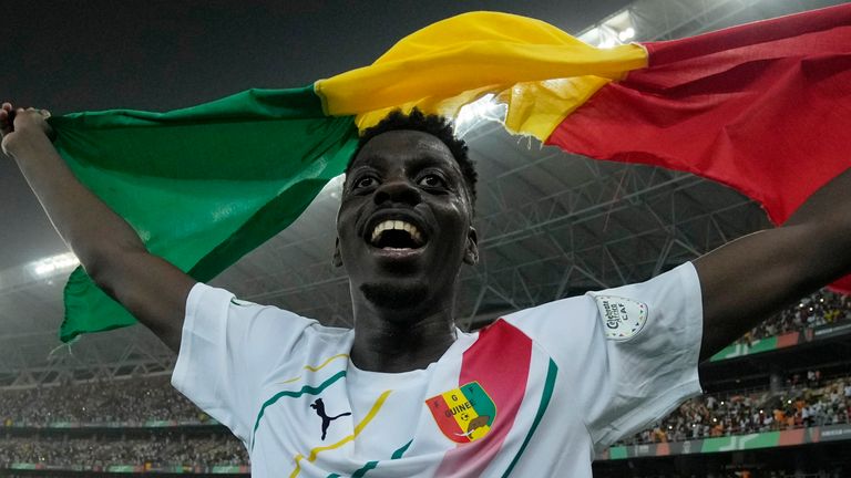 Guinea's Mohamed Bayo celebrates after scoring the winning goal during the African Cup of Nations Round of 16 soccer match between Equatorial Guinea and Guinea, at the Olympic Stadium of Ebimpe in Abidjan, Ivory Coast, Sunday, Jan. 28, 2024. (AP Photo/Themba Hadebe)