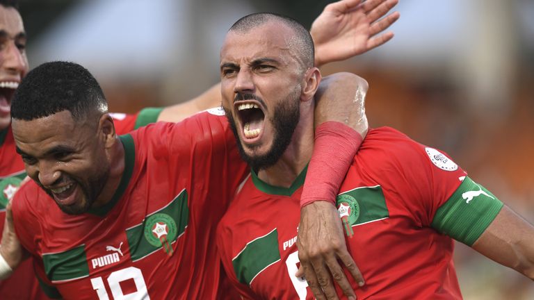 Romain Saiss (R) of Morocco celebrates after scoring a goal with his teammates during the Africa Cup of Nations (CAN) 2024 Group F football match between Morocco and Tanzania