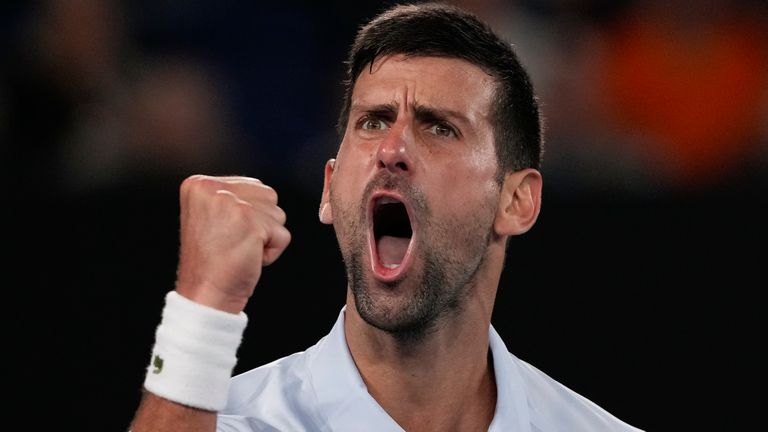 Serbia's Novak Djokovic celebrates after winning the third set against Croatia's Dino Prizmic during their first round match at the Australian Open tennis championships at Melbourne Park, Melbourne, Australia, Sunday, Jan. 14, 2024. (AP Photo/Andy Wong)