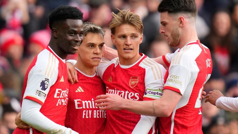 Leandro Trossard is congratulated by his team-mates after scoring Arsenal's third goal against Crystal Palace