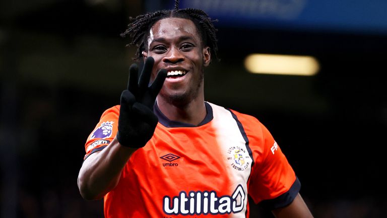 Elijah Adebayo celebrates after completing a hat-trick against Brighton