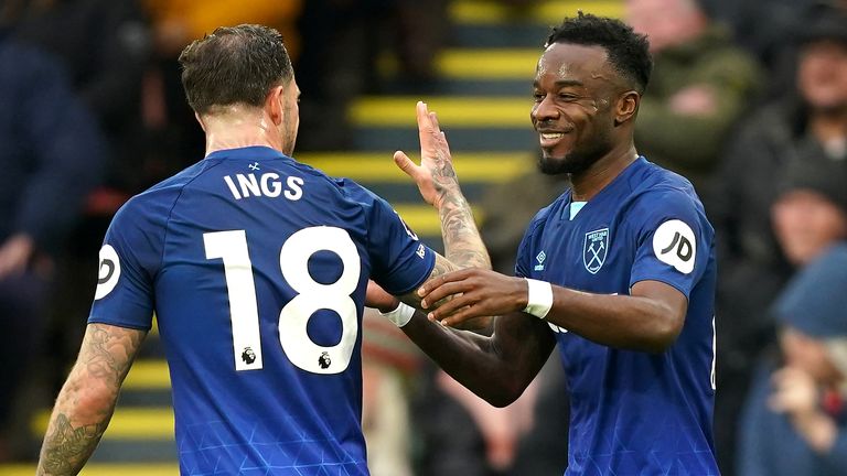 Maxwel Cornet celebrates with team-mate Danny Ings