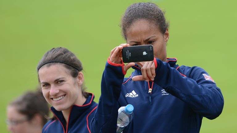 Great Britain's Rachel Yankey (right) and Karen Carney watch the men's team during a training session at Champneys Hotel and Spa, Leicestershire.