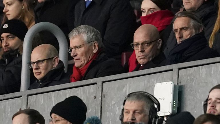 Director of sport at INEOS Sir Dave Brailsford (second right) in the stands at the DW Stadium